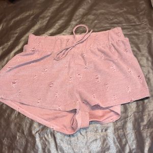 Pink shorts w a rip pattern